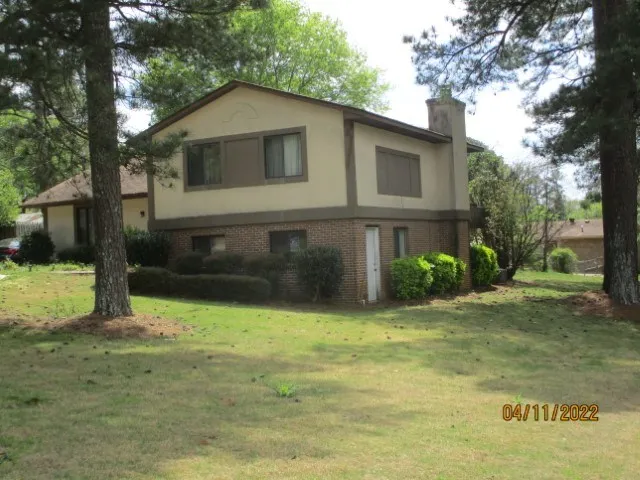 a kitchen with stainless steel appliances a refrigerator and a stove