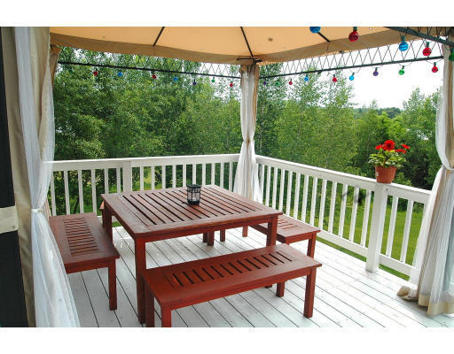 23 Hathaway Road Westhampton, MA 01027 - Photo 3 of 12 a view of a wooden bench on the deck