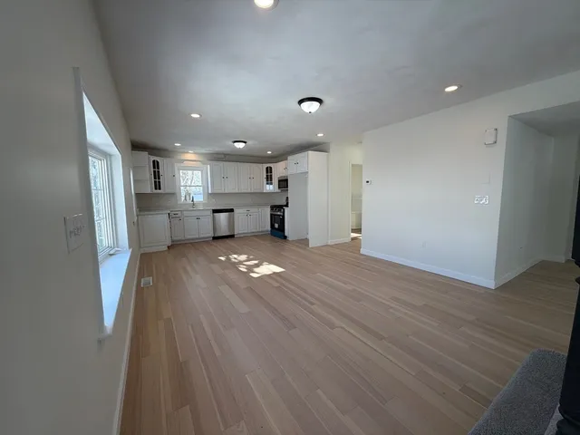 a white bath tub sitting next to a toilet