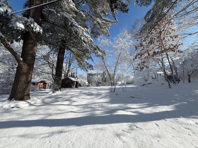a view of snow on the side of a road