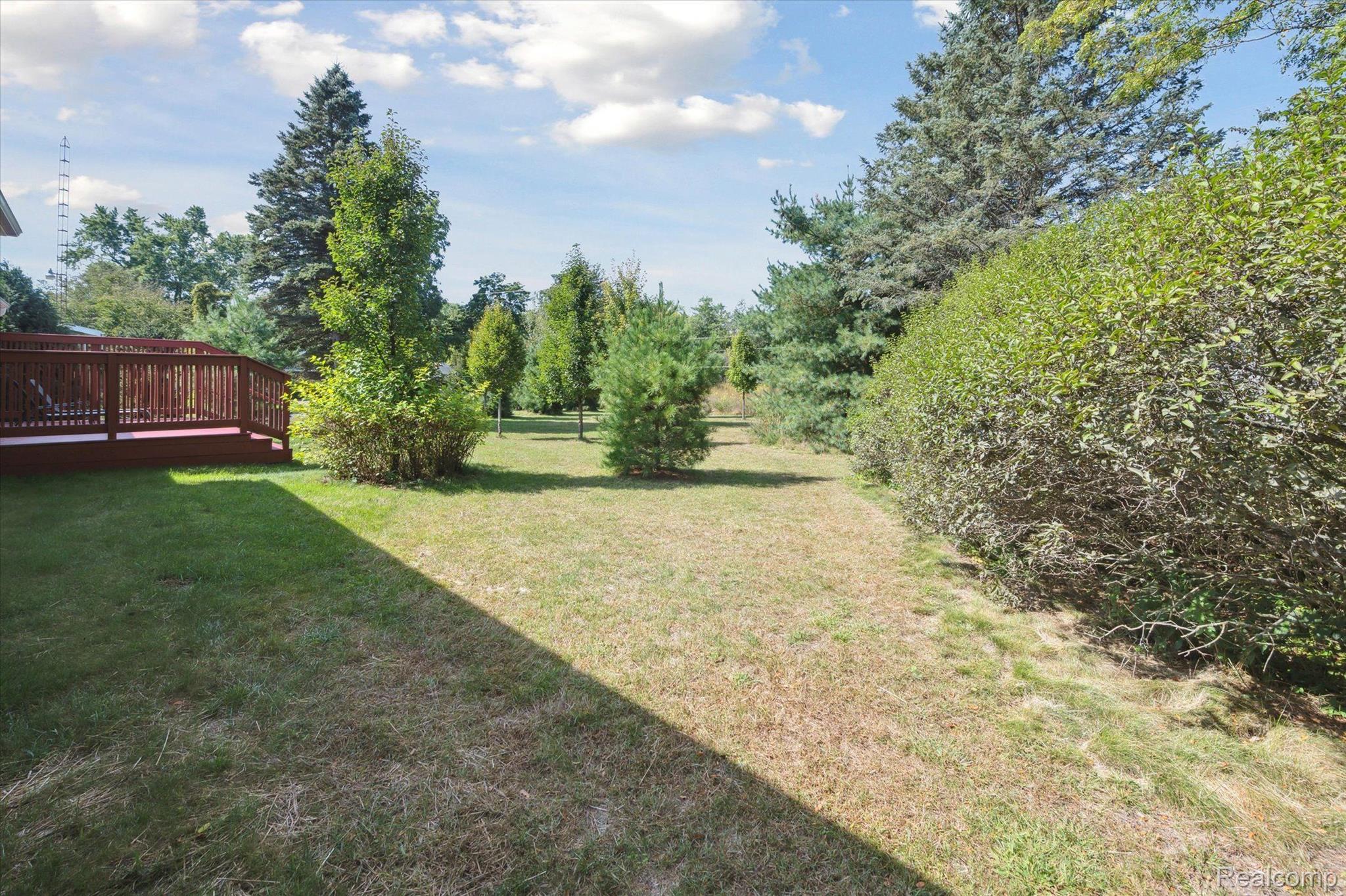5307 North Seymour Road Flushing, MI 48433 - Photo 31 of 33 Private side yard with tree-lined views.