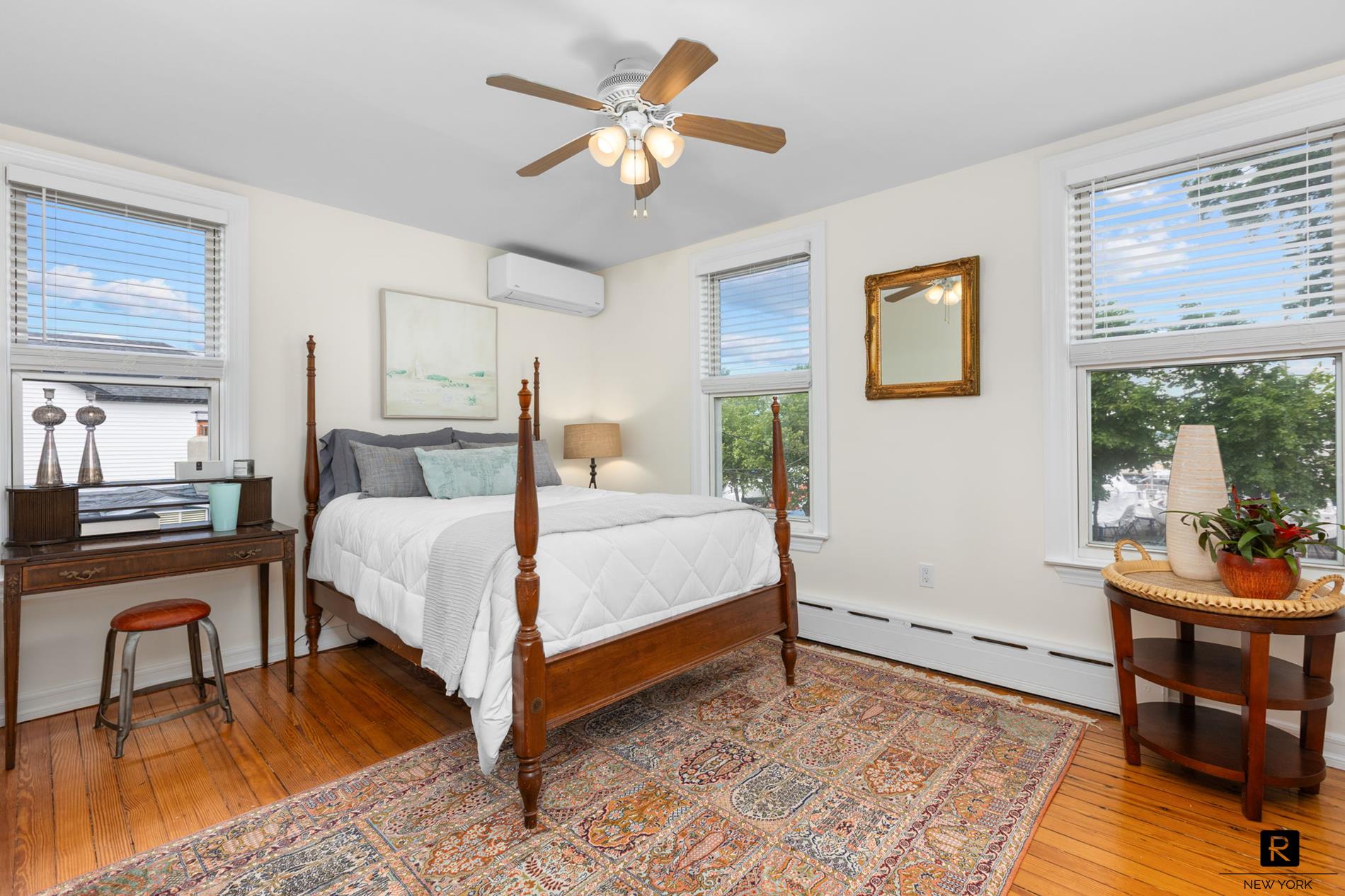 111 Rochelle Street Bronx, NY 10464 - Photo 9 of 28 a bedroom with a bed and a table in it