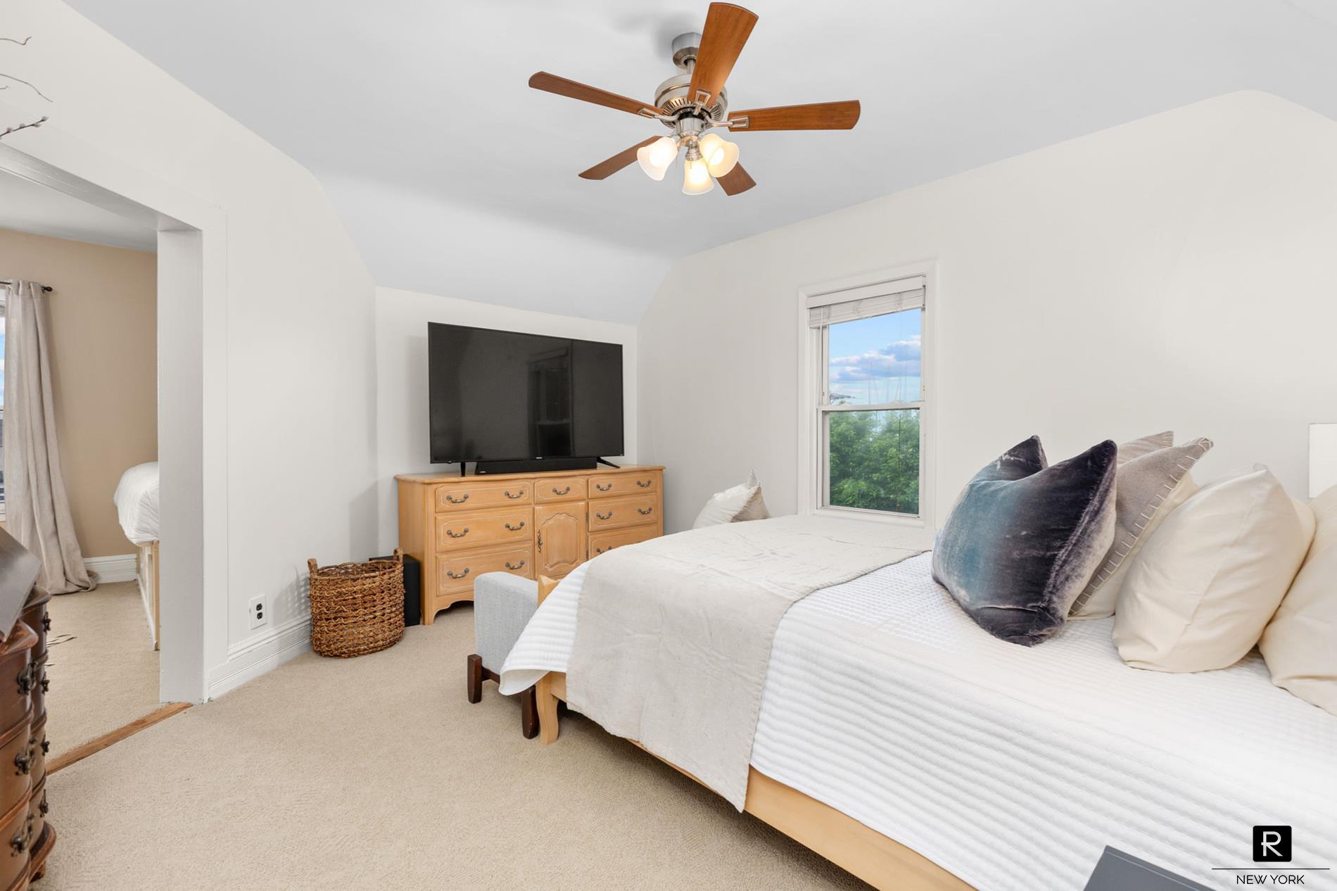 111 Rochelle Street Bronx, NY 10464 - Photo 13 of 28 a bedroom with a bed and a flat screen tv