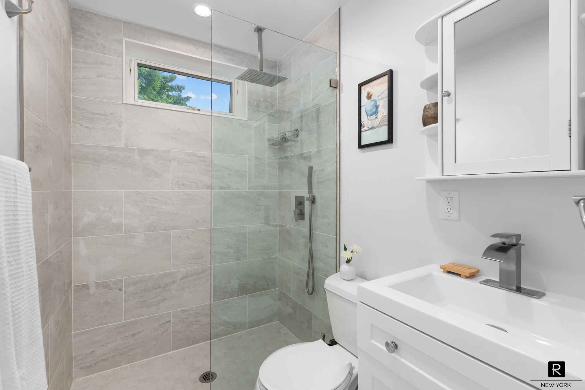 111 Rochelle Street Bronx, NY 10464 - Photo 23 of 28 a bathroom with a toilet sink and shower