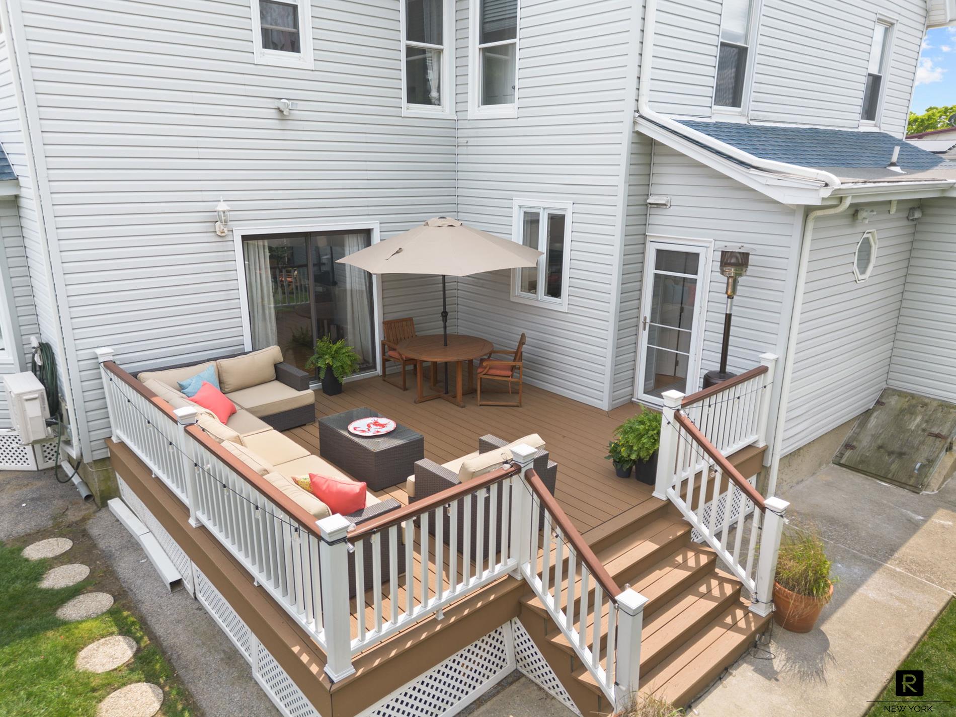 111 Rochelle Street Bronx, NY 10464 - Photo 24 of 28 a view of a patio with a table and chairs