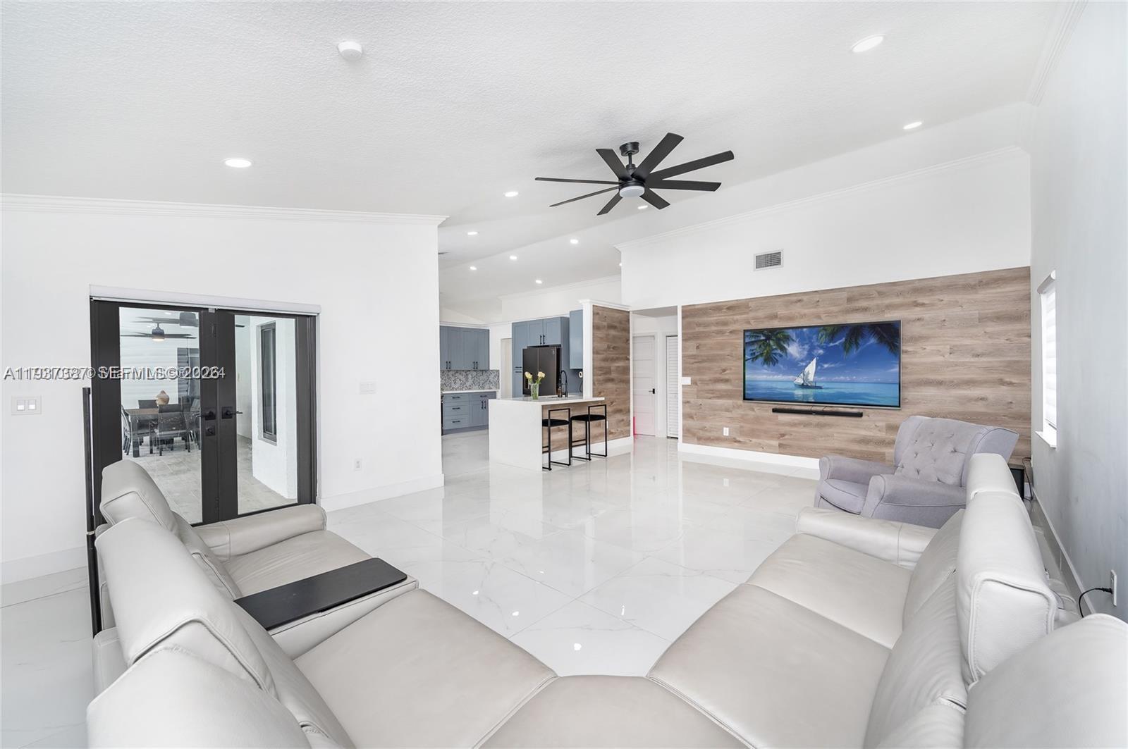 9701 Southwest 56th Terrace Miami, FL 33173 - Photo 23 of 48 a living room with stainless steel appliances furniture and a rug