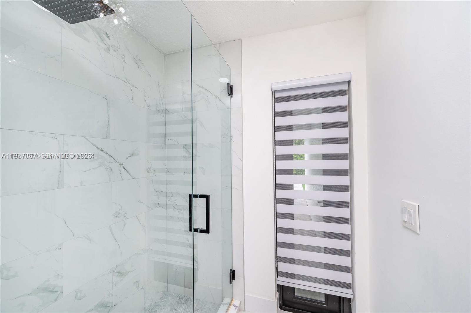 9701 Southwest 56th Terrace Miami, FL 33173 - Photo 26 of 48 a bathroom with a shower and a sink