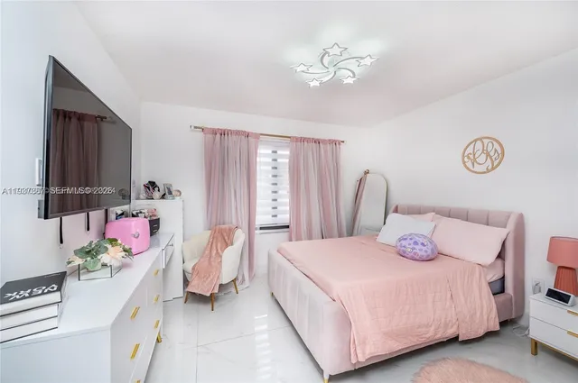 a bathroom with a double vanity sink mirror and shower