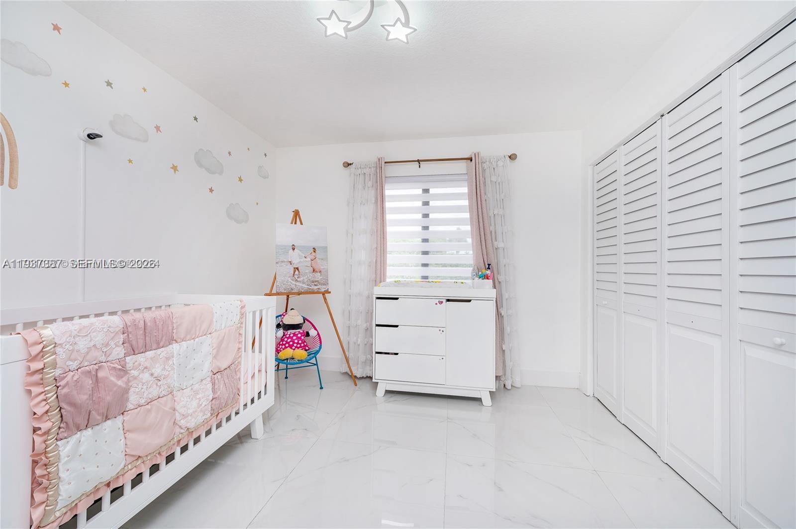 9701 Southwest 56th Terrace Miami, FL 33173 - Photo 33 of 48 a bedroom with furniture and a window