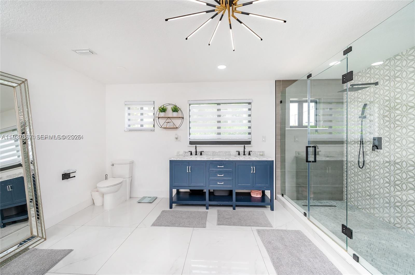 9701 Southwest 56th Terrace Miami, FL 33173 - Photo 35 of 48 a view of a bathroom with a bathtub and a shower