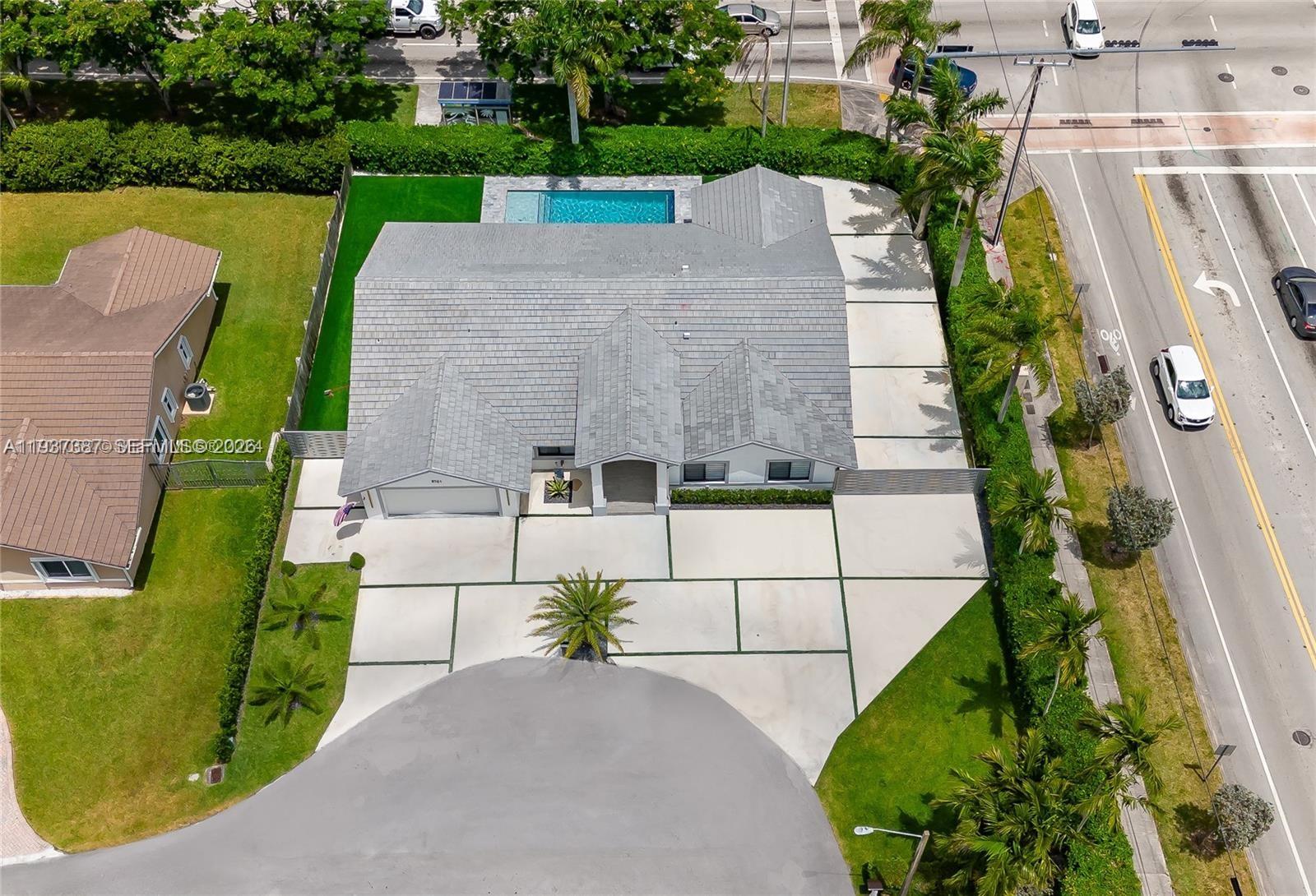 9701 Southwest 56th Terrace Miami, FL 33173 - Photo 38 of 48 an aerial view of a house with a garden and swimming pool