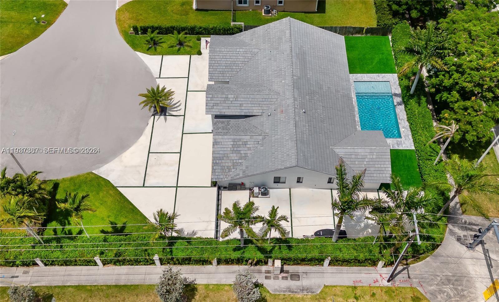 9701 Southwest 56th Terrace Miami, FL 33173 - Photo 39 of 48 an aerial view of a house with a swimming pool