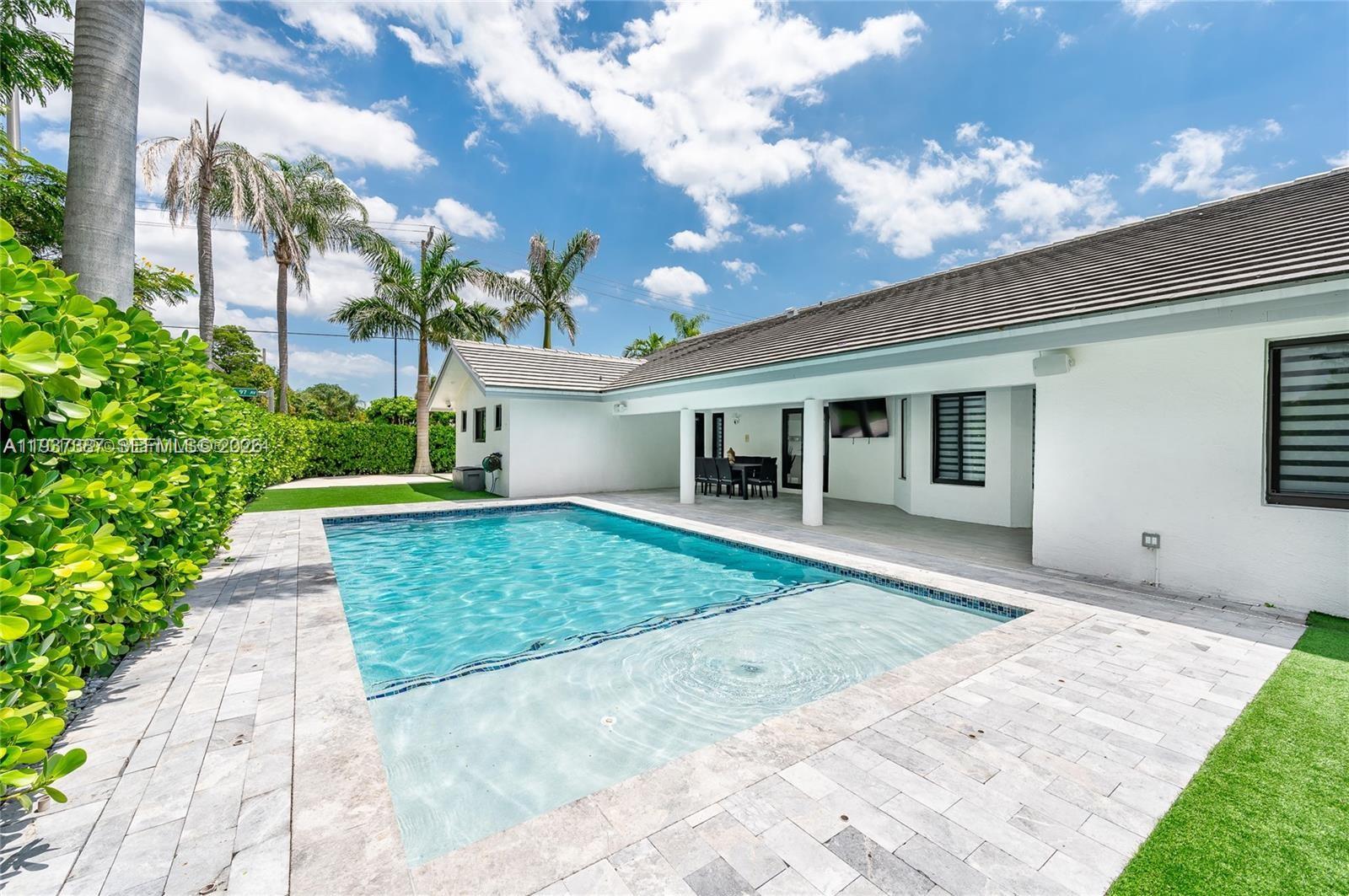 9701 Southwest 56th Terrace Miami, FL 33173 - Photo 43 of 48 a front view of a house with garden