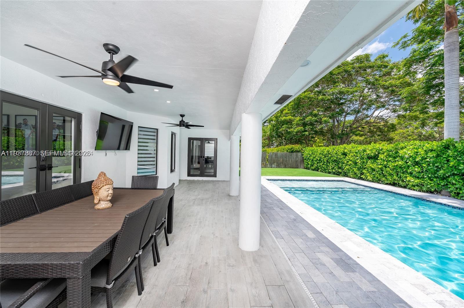 9701 Southwest 56th Terrace Miami, FL 33173 - Photo 44 of 48 a view of a patio with a table and chairs