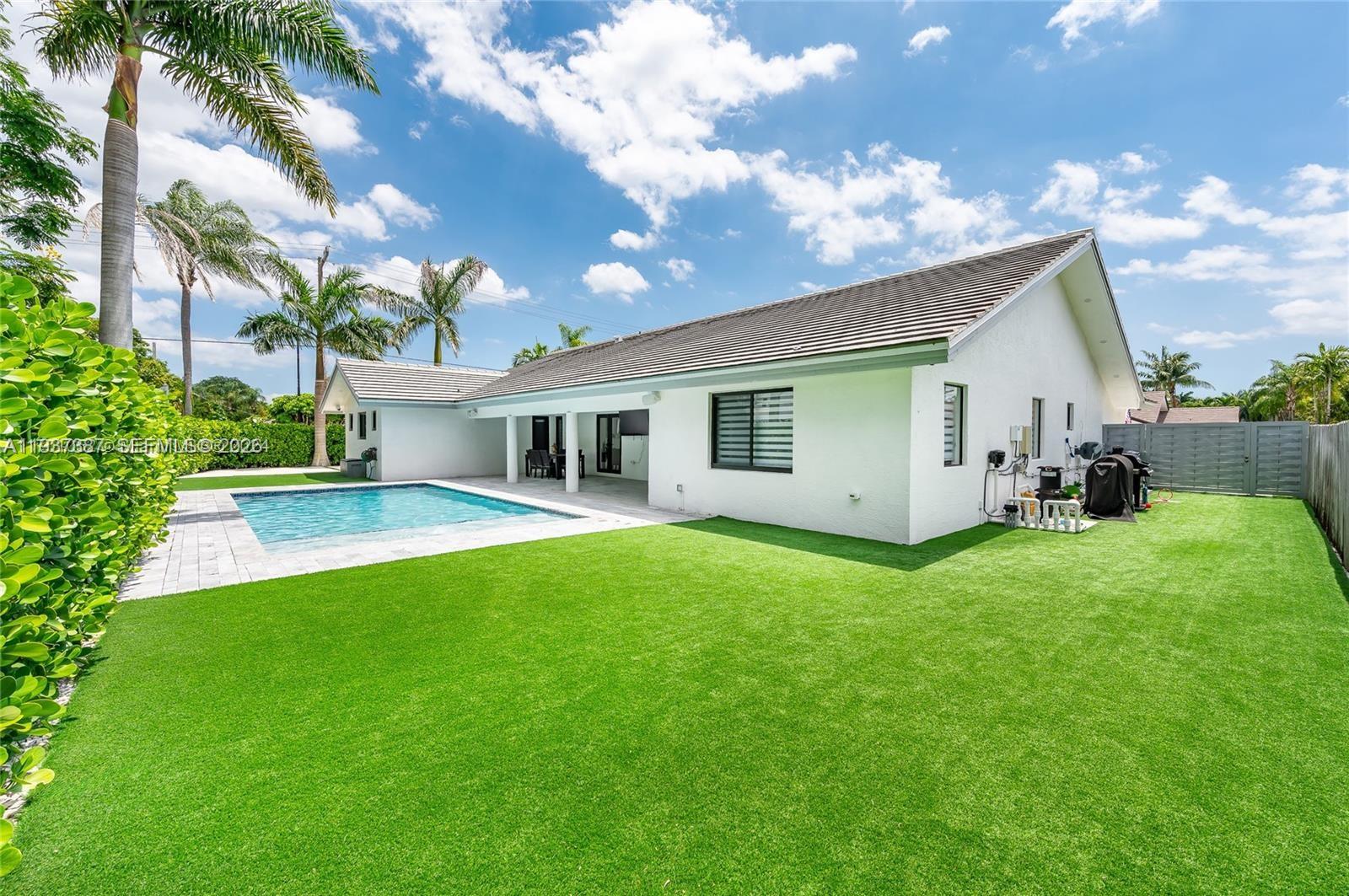 9701 Southwest 56th Terrace Miami, FL 33173 - Photo 46 of 48 a front view of house with yard and seating