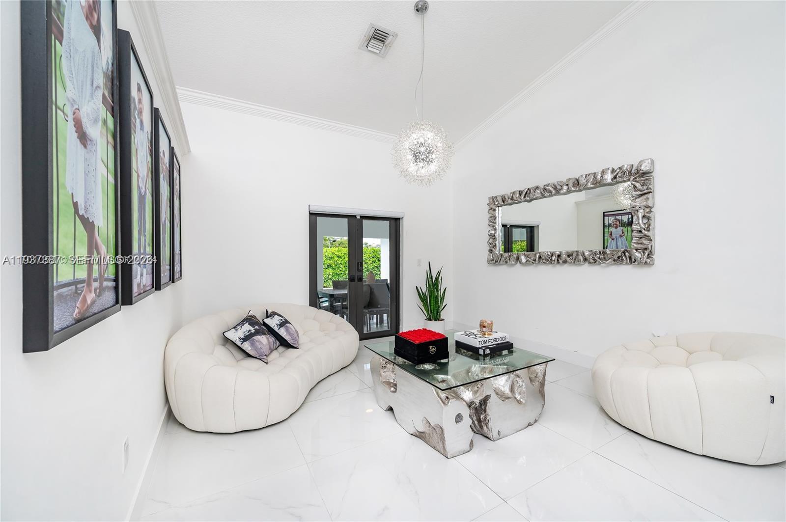 9701 Southwest 56th Terrace Miami, FL 33173 - Photo 7 of 48 a living room with furniture and a table