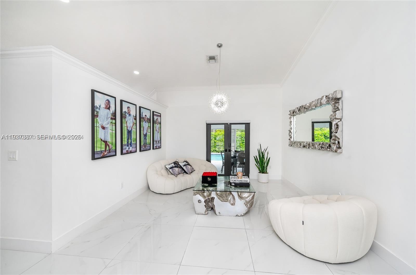 9701 Southwest 56th Terrace Miami, FL 33173 - Photo 8 of 48 a room with furniture and a large window