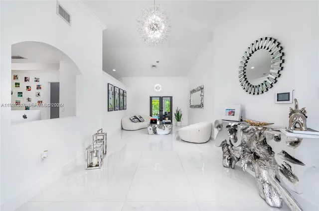 a room with furniture and potted plant