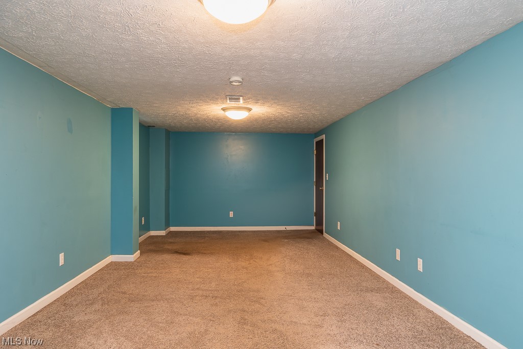 4651 East Pleasant Valley Road Independence, OH 44131 - Photo 22 of 28 Finished basement perfect for a pool table, watching sports, crafting or hanging out.