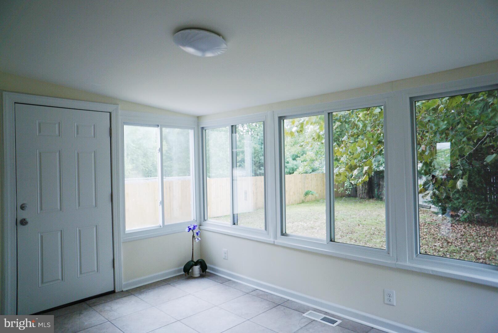 5215 Trumps Mill Road Baltimore, MD 21206 - Photo 7 of 27 FLORIDA SUNROOM OR FAMILY ROOM W/ OUTSIDE ACCESS