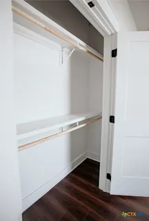 a view of an empty walk in closet