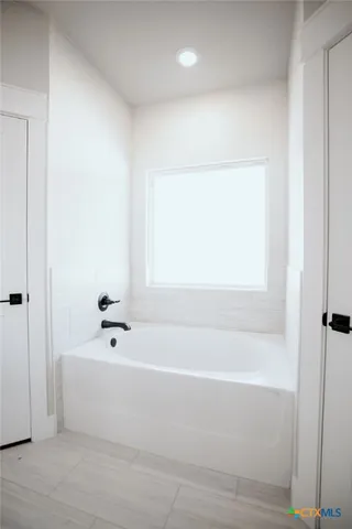 a bathroom with a bathtub