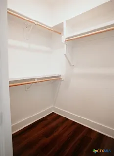 a view of an empty walk in closet