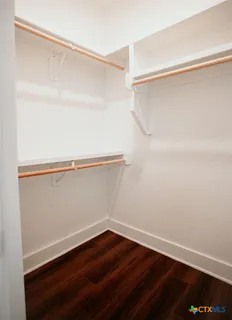 a view of an empty walk in closet