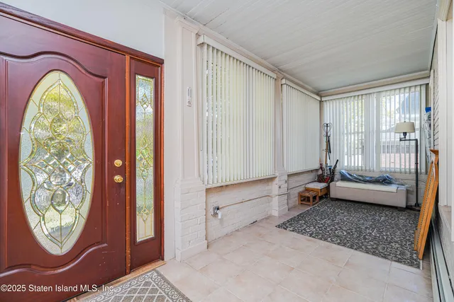 a living room with a couch and a window