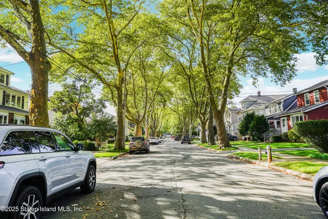 a view of street with parked cars