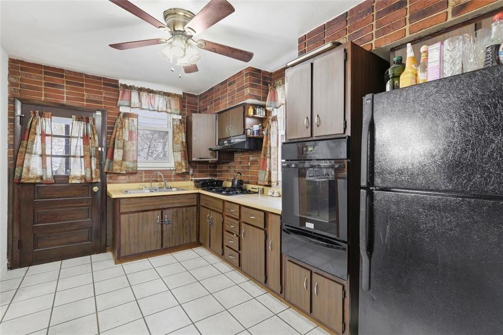 238 Provost Road Pittsburgh, PA 15227 - Photo 13 of 34 a kitchen with a refrigerator a sink and dishwasher