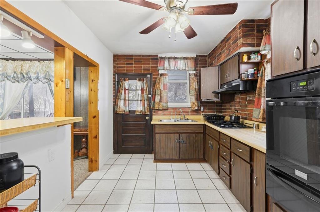 238 Provost Road Pittsburgh, PA 15227 - Photo 14 of 34 a kitchen with stainless steel appliances granite countertop a refrigerator and a sink