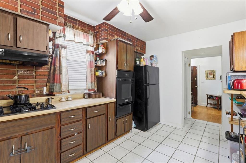 238 Provost Road Pittsburgh, PA 15227 - Photo 16 of 34 a kitchen with a sink refrigerator and cabinets