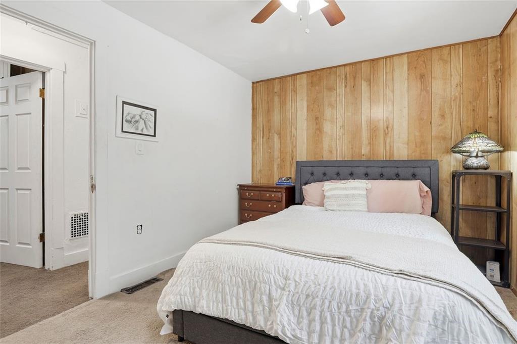 238 Provost Road Pittsburgh, PA 15227 - Photo 19 of 34 a bedroom with a bed and a chandelier