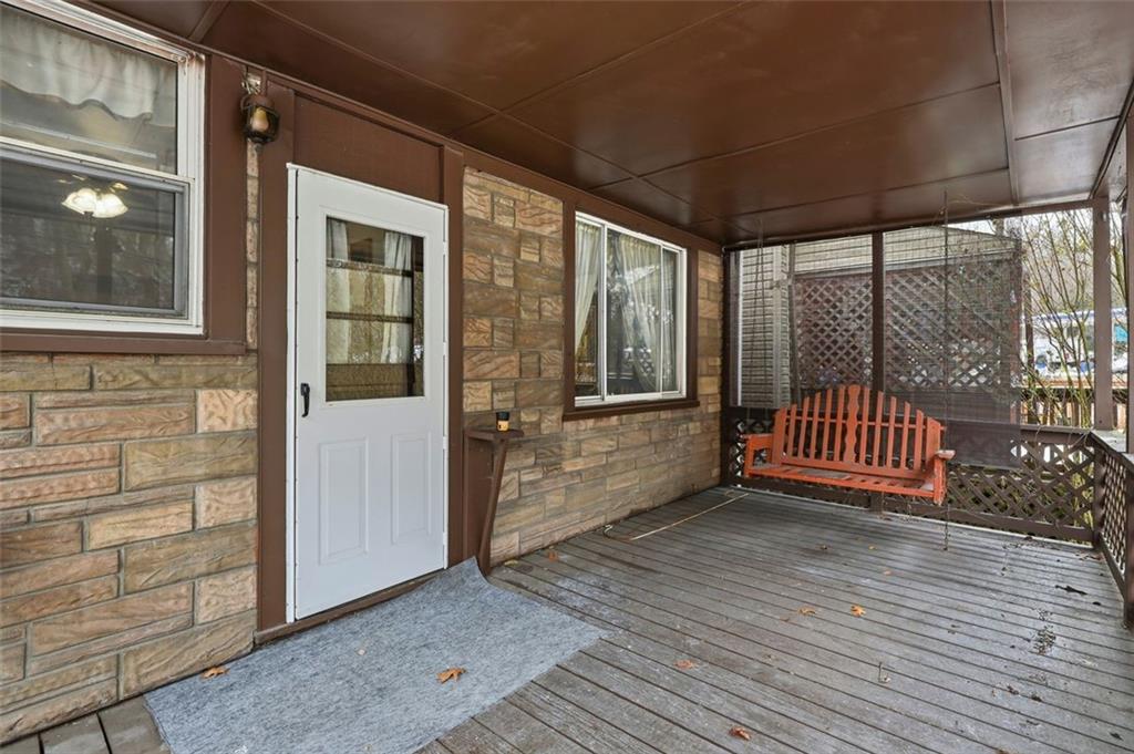 238 Provost Road Pittsburgh, PA 15227 - Photo 28 of 34 a view of a room with wooden floor and iron stairs
