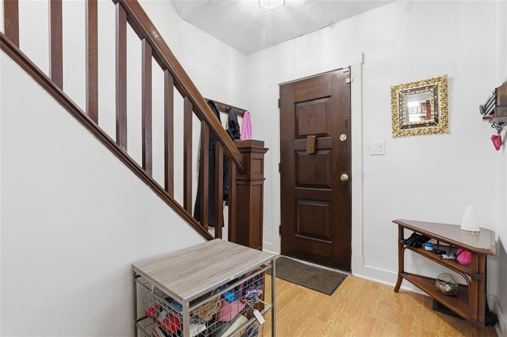 238 Provost Road Pittsburgh, PA 15227 - Photo 5 of 34 a living room with wooden floor and stairs