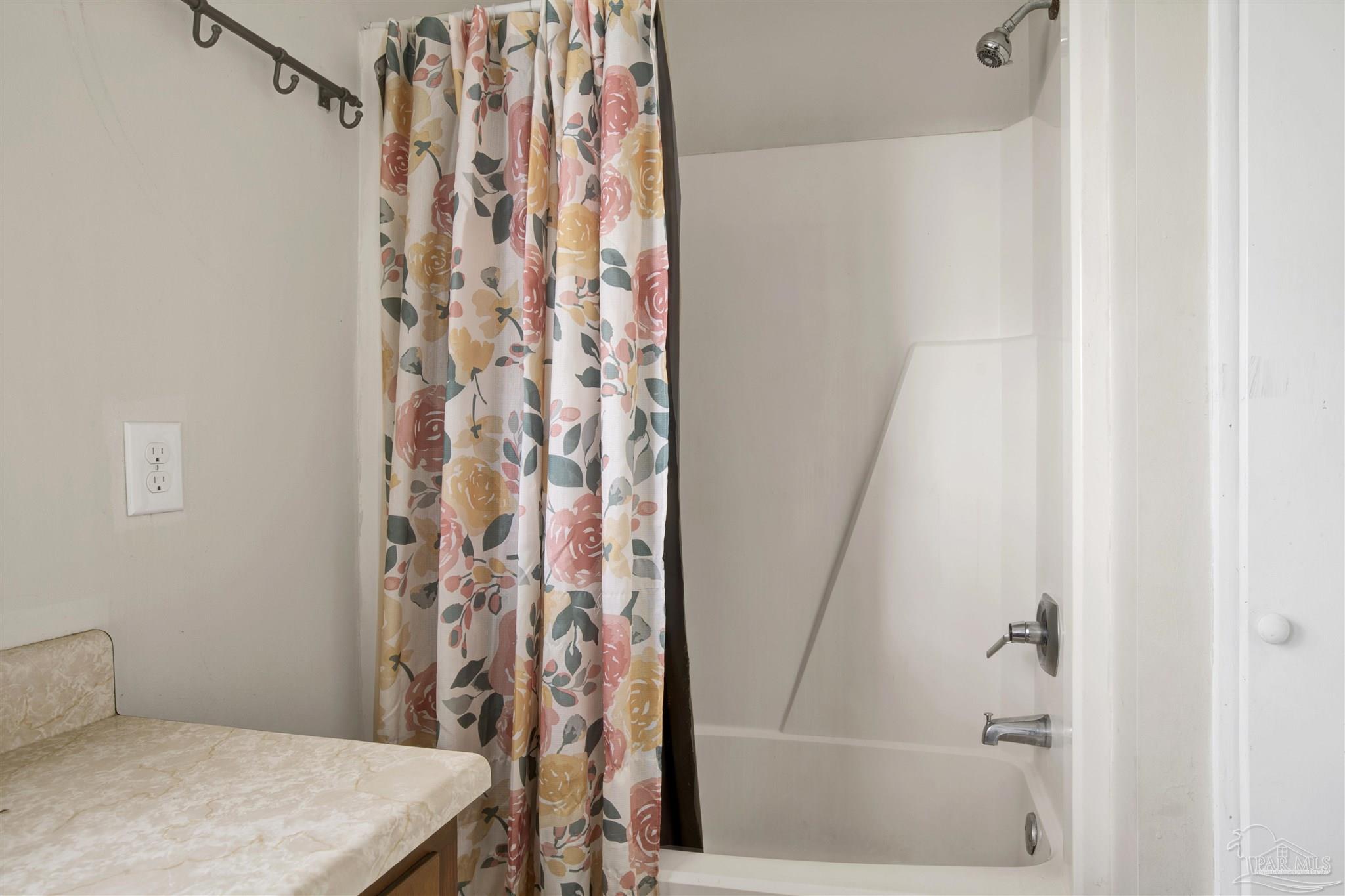 2802 West Gonzalez Street Pensacola, FL 32505 - Photo 15 of 24 a bathroom with a shower and a sink