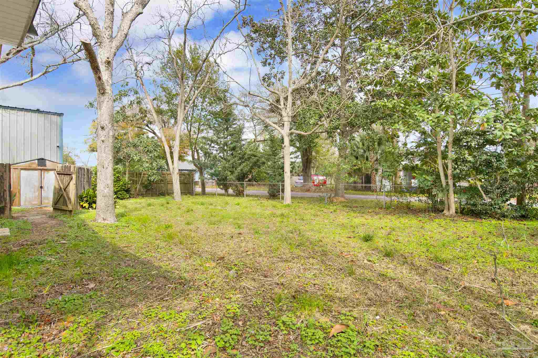 2802 West Gonzalez Street Pensacola, FL 32505 - Photo 23 of 24 a house view with swimming pool