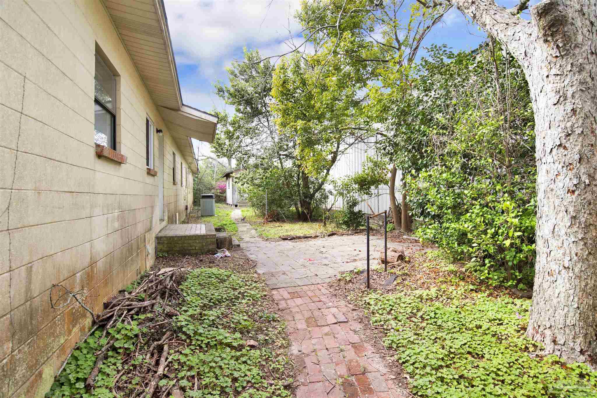 2802 West Gonzalez Street Pensacola, FL 32505 - Photo 24 of 24 a pathway of a house with a yard