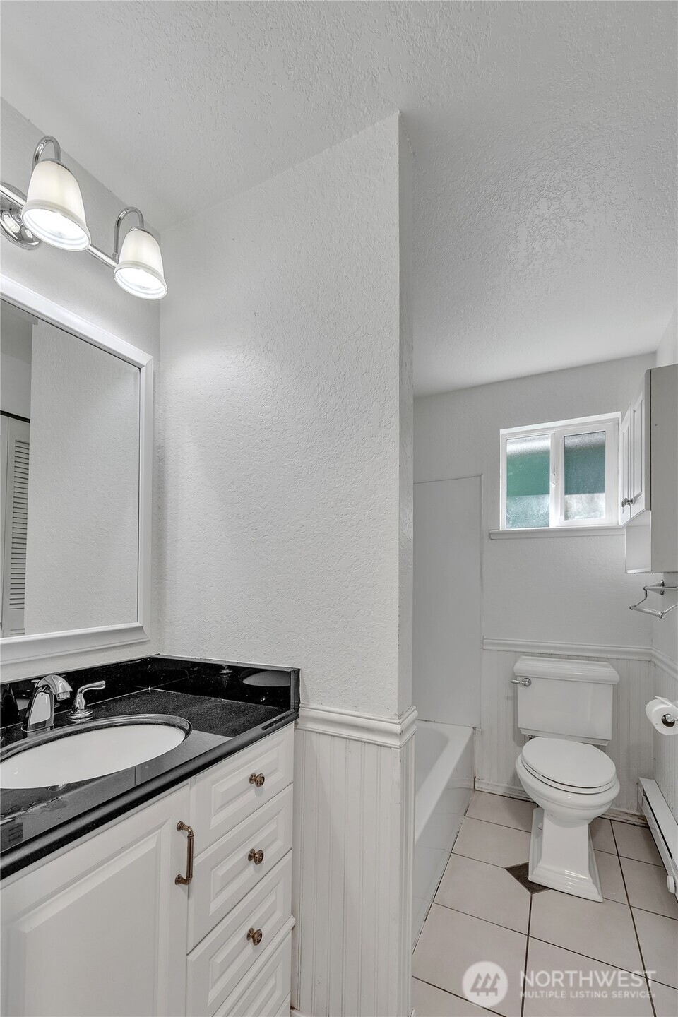 7914 242nd Street Southwest Edmonds, WA 98026 - Photo 15 of 38 a bathroom with a granite countertop toilet sink and mirror