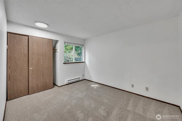 a view of an empty room with windows