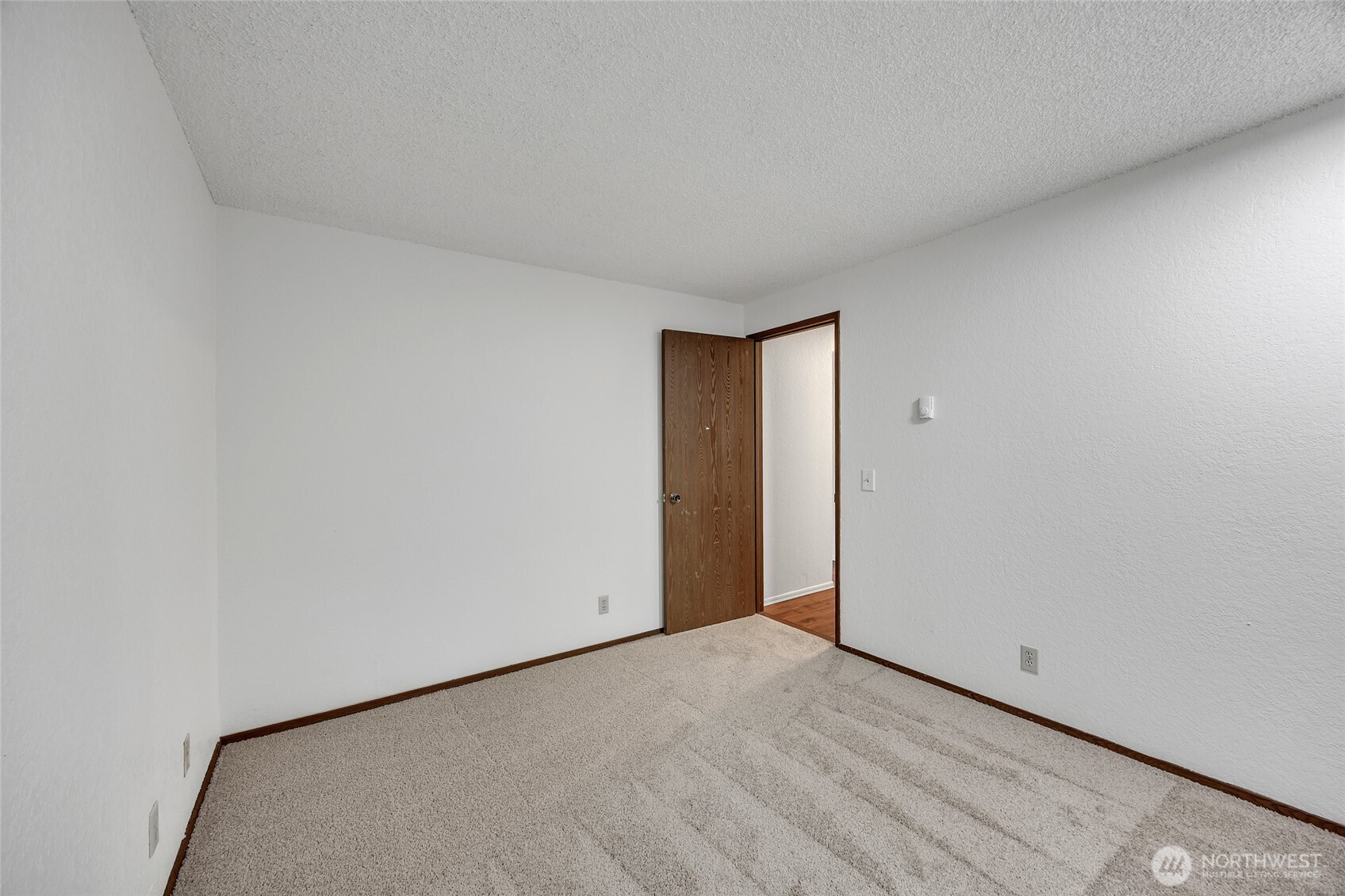 7914 242nd Street Southwest Edmonds, WA 98026 - Photo 17 of 38 a view of an empty room and wooden floor