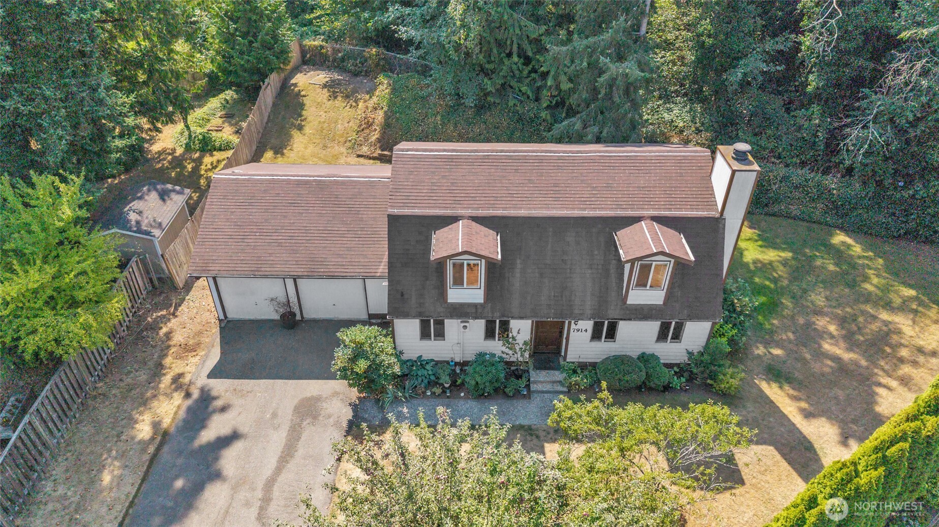 7914 242nd Street Southwest Edmonds, WA 98026 - Photo 2 of 38 an aerial view of a house with garden space and a yard