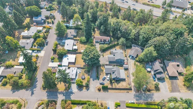an aerial view of a house with a yard