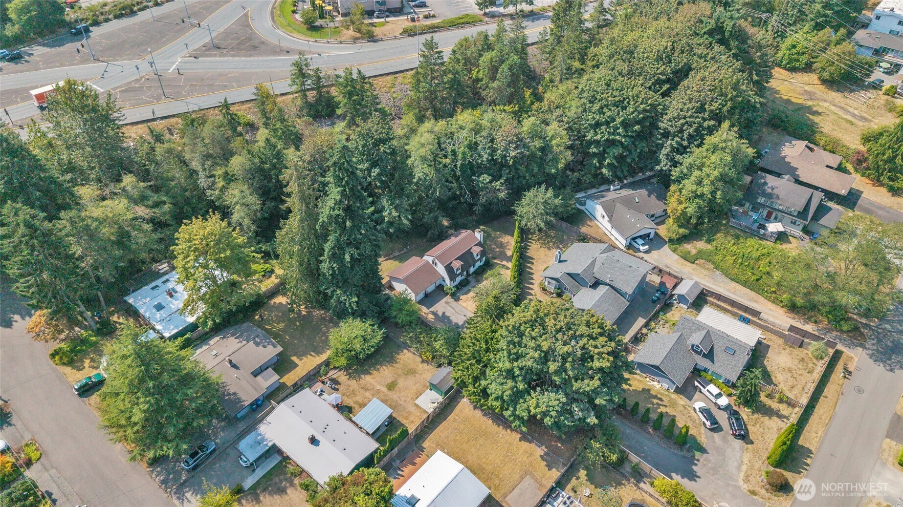 7914 242nd Street Southwest Edmonds, WA 98026 - Photo 34 of 38 an aerial view of a house with yard swimming pool and outdoor seating