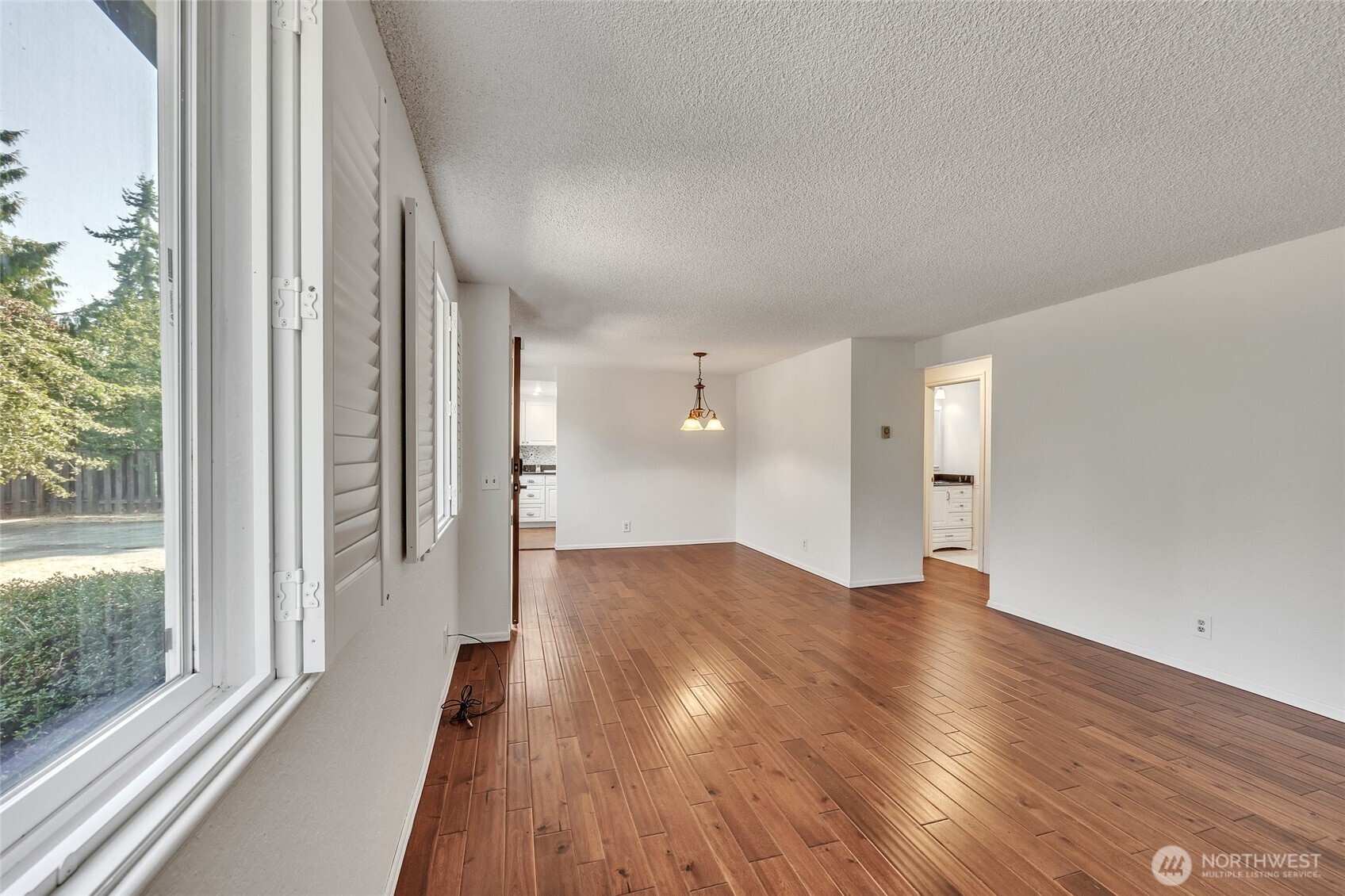 7914 242nd Street Southwest Edmonds, WA 98026 - Photo 10 of 38 a view of wooden floor and windows in an empty room