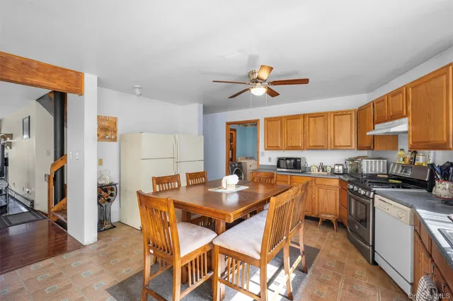 a view of a kitchen and dining room