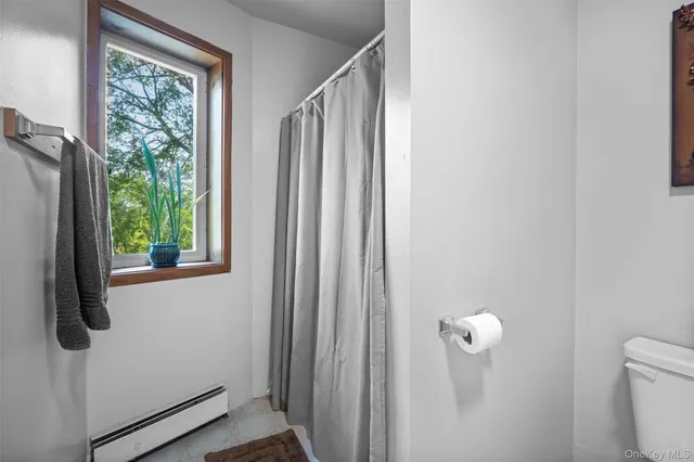 a bathroom with a shower curtain