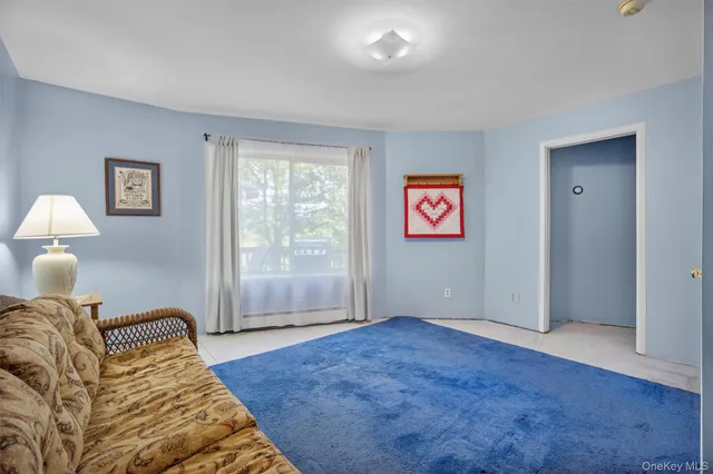 a bedroom with bed and a window