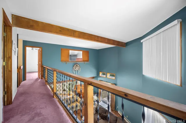 a view of a hallway with a window